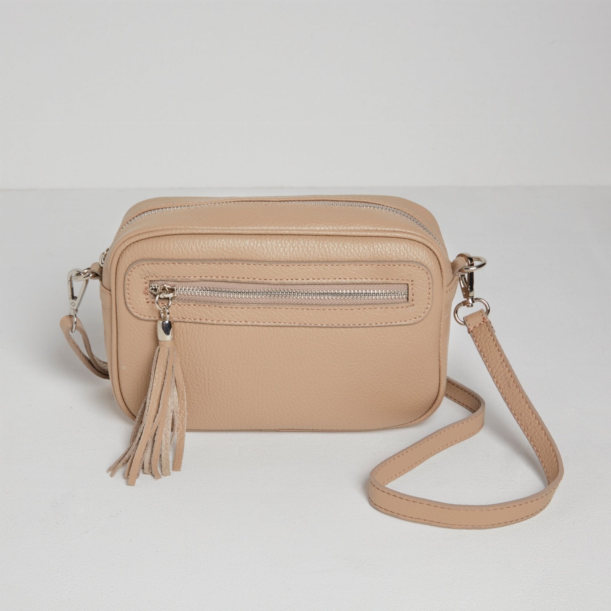 Crossbody bag with striped strap best sale