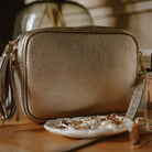 Verona Crossbody Gold Tassel Bag With Dark Blue Leopard Strap Gold | Betsy & Floss